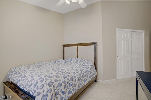 carpeted bedroom with a ceiling fan and baseboards