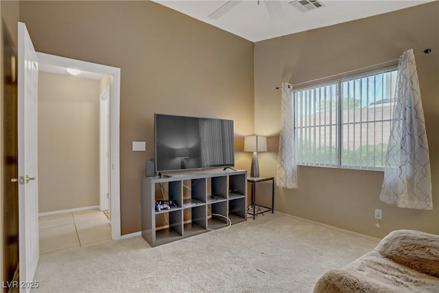 sitting room featuring tile patterned flooring, carpet flooring, baseboards, ceiling fan, and visible vents
