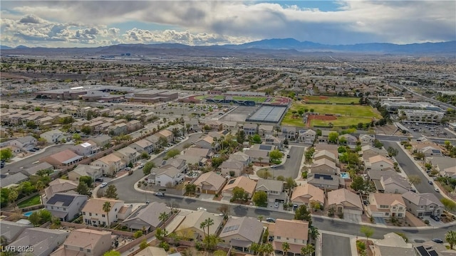 birds eye view of property with a residential view and a mountain view