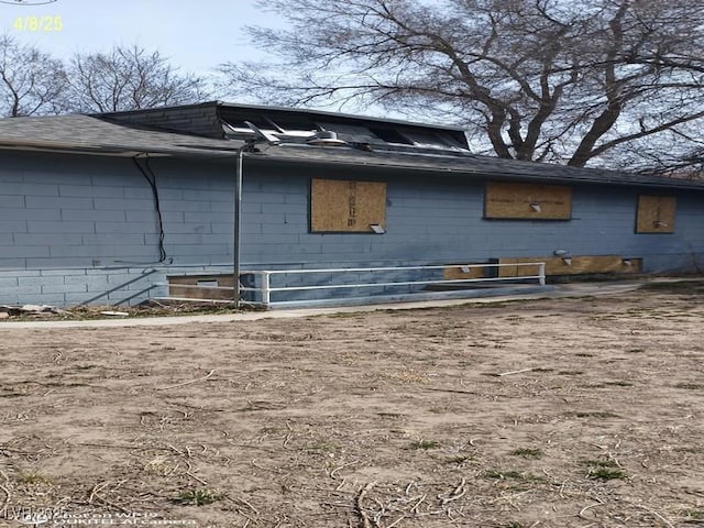 1550 Murry St, Ely, NV 89301 - view of home's exterior with concrete block siding and roof with shingles