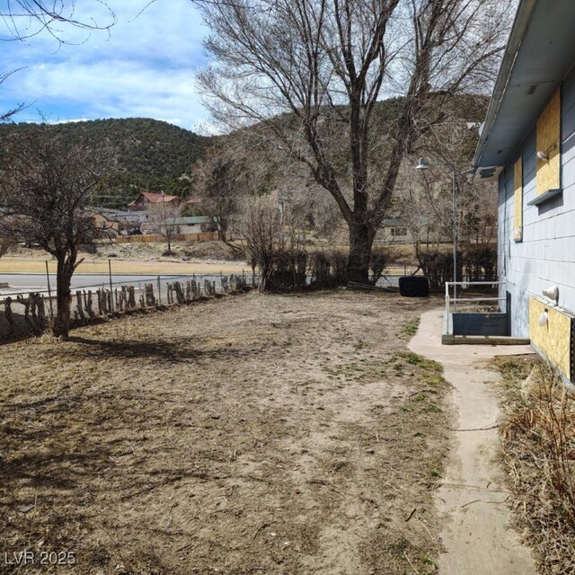 1550 Murry St, Ely, NV 89301 - view of yard featuring a mountain view and fence