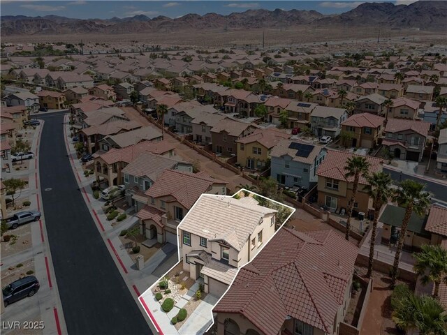 aerial view featuring a mountain view and a residential view