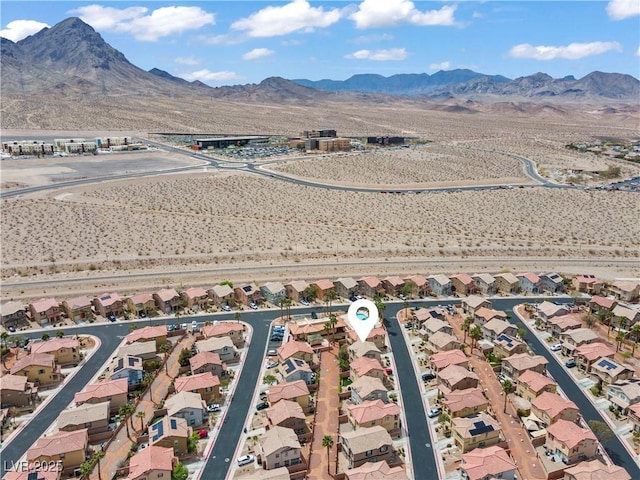 birds eye view of property featuring a mountain view and a residential view