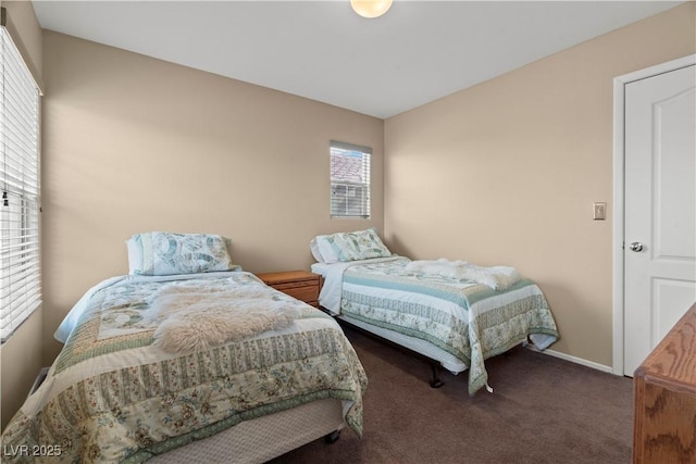 carpeted bedroom with baseboards