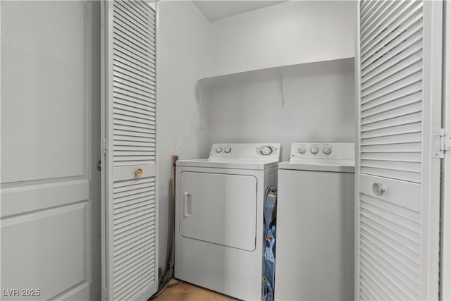 laundry room featuring washer and dryer and laundry area
