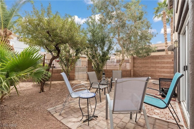 view of patio featuring fence
