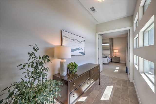 10 Sugarberry Ln, Las Vegas, NV 89135 - corridor featuring healthy amount of natural light, light carpet, and baseboards