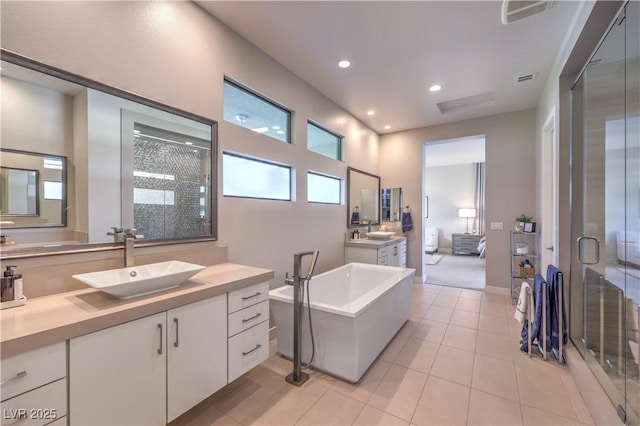 10 Sugarberry Ln, Las Vegas, NV 89135 - full bathroom with a shower stall, tile patterned floors, a freestanding bath, recessed lighting, and two vanities