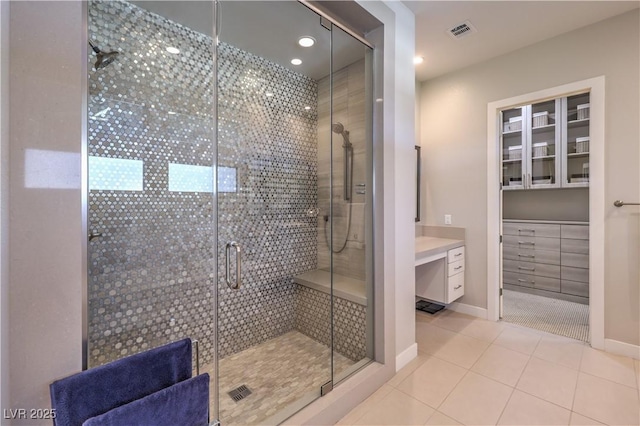 10 Sugarberry Ln, Las Vegas, NV 89135 - bathroom with a stall shower, baseboards, tile patterned floors, and recessed lighting