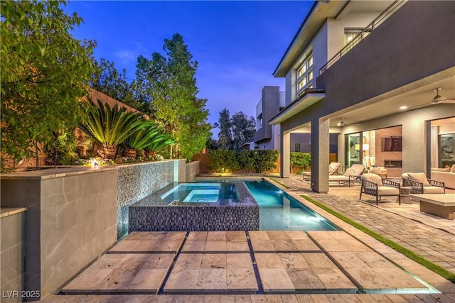 10 Sugarberry Ln, Las Vegas, NV 89135 - view of pool with a patio, an in-ground hot tub, an outdoor hangout area, and a fenced backyard