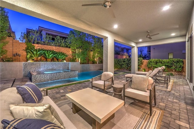 10 Sugarberry Ln, Las Vegas, NV 89135 - fenced backyard with a ceiling fan, an outdoor living space, and a patio area