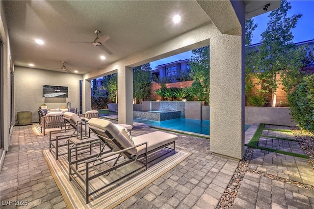 10 Sugarberry Ln, Las Vegas, NV 89135 - fenced backyard featuring ceiling fan, a patio, an outdoor living space, and a pool with connected hot tub