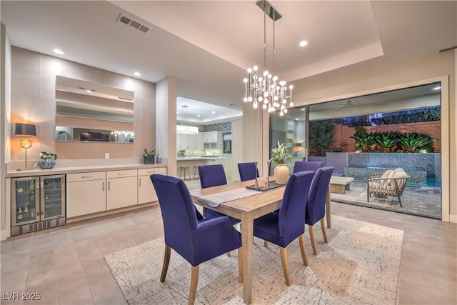 10 Sugarberry Ln, Las Vegas, NV 89135 - dining space featuring beverage cooler, recessed lighting, a raised ceiling, and a chandelier