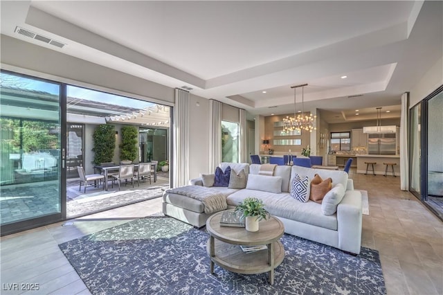 10 Sugarberry Ln, Las Vegas, NV 89135 - living area featuring a tray ceiling, a chandelier, and recessed lighting
