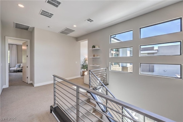 10 Sugarberry Ln, Las Vegas, NV 89135 - hallway with an upstairs landing, light carpet, recessed lighting, and baseboards