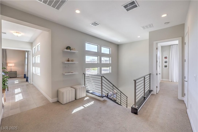 10 Sugarberry Ln, Las Vegas, NV 89135 - hallway with an upstairs landing, carpet floors, recessed lighting, baseboards, and tile patterned flooring