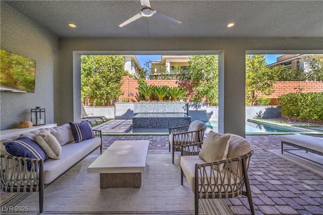 10 Sugarberry Ln, Las Vegas, NV 89135 - fenced backyard with an outdoor living space, a ceiling fan, and a patio