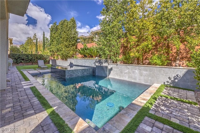10 Sugarberry Ln, Las Vegas, NV 89135 - outdoor pool with a patio and a fenced backyard