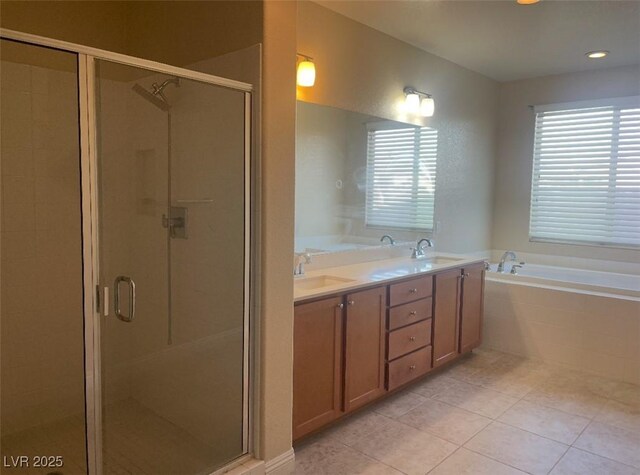 full bathroom with a sink, a bath, tile patterned floors, and a shower stall