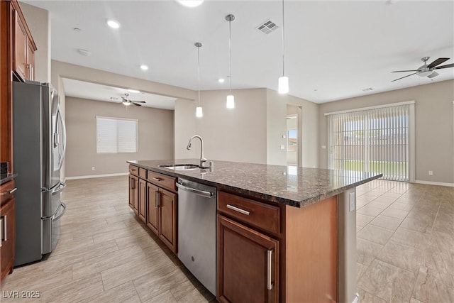 732 Rosewater Dr, Henderson, NV 89011 - kitchen featuring appliances with stainless steel finishes, ceiling fan, a sink, baseboards, and an island with sink