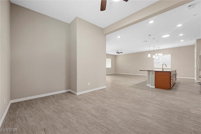 732 Rosewater Dr, Henderson, NV 89011 - unfurnished living room with a ceiling fan, plenty of natural light, baseboards, and recessed lighting