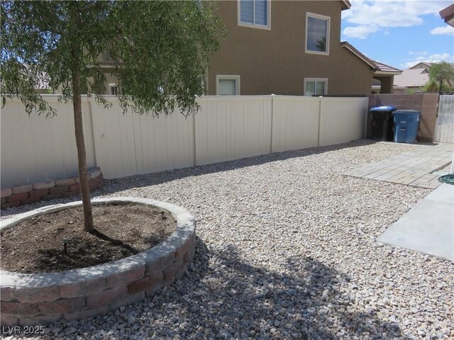 view of yard featuring a fenced backyard and a patio area