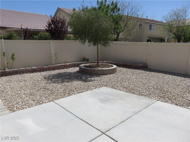 view of yard featuring a fenced backyard and a patio