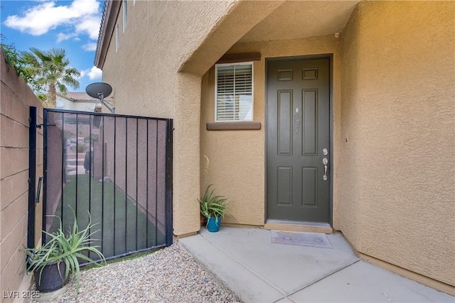 651 Penshaw Bridge Ave, Las Vegas, NV 89178 - property entrance featuring stucco siding and a gate