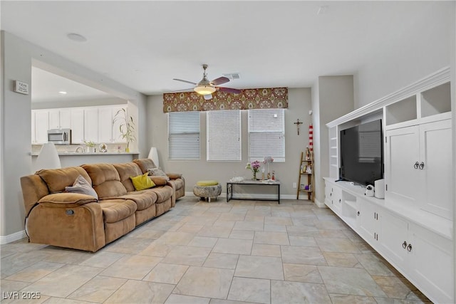 651 Penshaw Bridge Ave, Las Vegas, NV 89178 - living area featuring a ceiling fan and baseboards