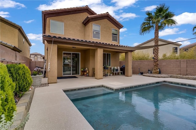 651 Penshaw Bridge Ave, Las Vegas, NV 89178 - rear view of property featuring stucco siding, a patio area, a fenced backyard, and a tile roof