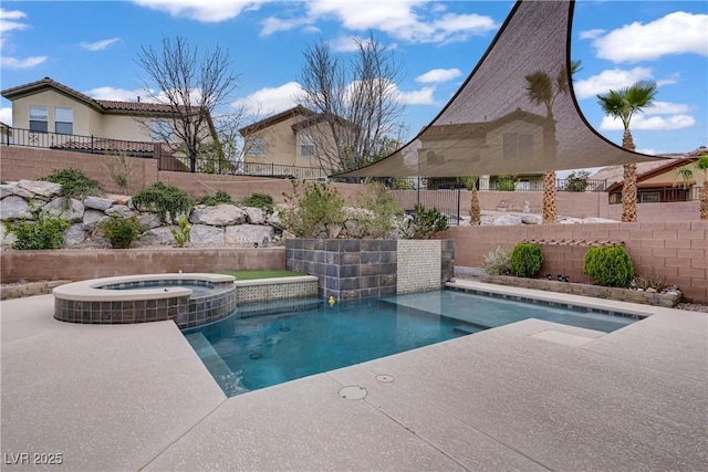 651 Penshaw Bridge Ave, Las Vegas, NV 89178 - view of pool featuring a fenced backyard, a pool with connected hot tub, and a patio area
