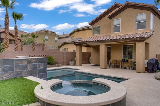 651 Penshaw Bridge Ave, Las Vegas, NV 89178 - rear view of house with a tile roof, stucco siding, a patio, a fenced backyard, and a pool with connected hot tub