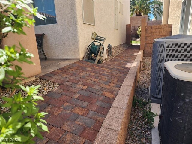 2727 Warm Rays Ave, Henderson, NV 89052 - view of patio / terrace featuring cooling unit, fence, and a gate