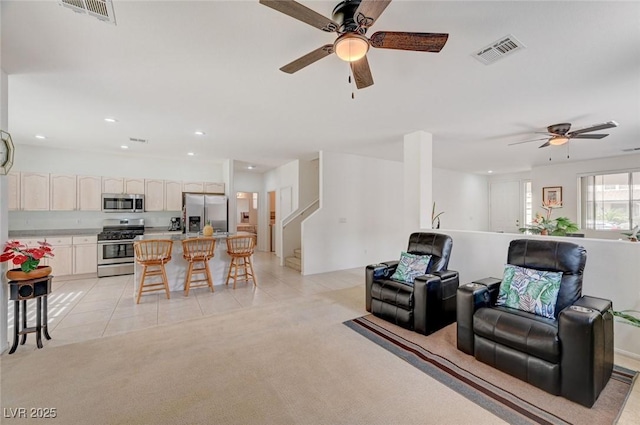 775 Wigan Pier Dr, Henderson, NV 89002 - living area with ceiling fan, visible vents, light tile patterned floors, and light colored carpet