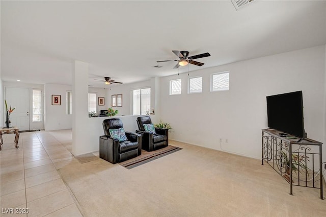 775 Wigan Pier Dr, Henderson, NV 89002 - living room with ceiling fan, visible vents, light tile patterned floors, and light carpet