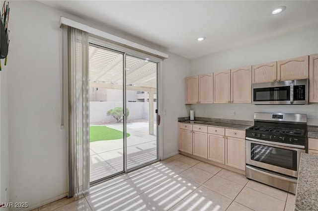 775 Wigan Pier Dr, Henderson, NV 89002 - kitchen featuring light brown cabinets, recessed lighting, light tile patterned floors, and appliances with stainless steel finishes