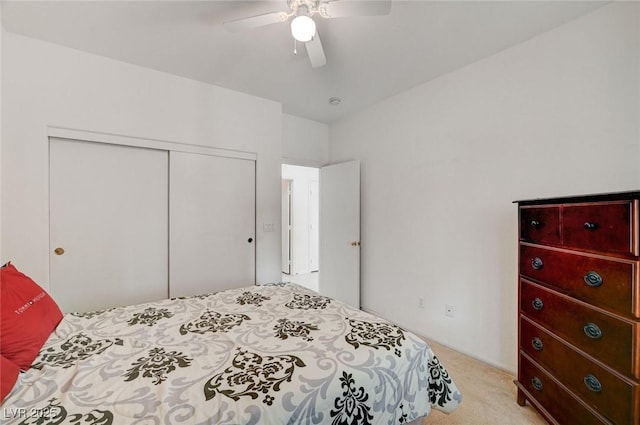 775 Wigan Pier Dr, Henderson, NV 89002 - bedroom with light carpet, a closet, and a ceiling fan