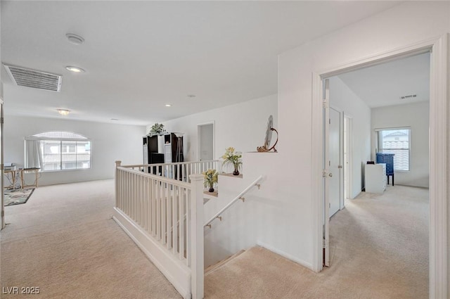 775 Wigan Pier Dr, Henderson, NV 89002 - hallway with visible vents, an upstairs landing, carpet, and a healthy amount of sunlight
