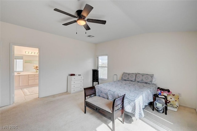775 Wigan Pier Dr, Henderson, NV 89002 - bedroom with visible vents, a ceiling fan, lofted ceiling, ensuite bath, and light colored carpet