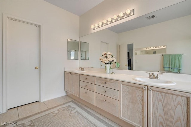 775 Wigan Pier Dr, Henderson, NV 89002 - bathroom with tile patterned floors, visible vents, double vanity, and a sink