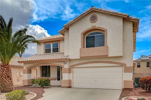 775 Wigan Pier Dr, Henderson, NV 89002 - mediterranean / spanish-style house featuring a tile roof, concrete driveway, stucco siding, and a garage