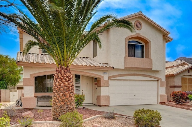 775 Wigan Pier Dr, Henderson, NV 89002 - mediterranean / spanish-style home featuring driveway, fence, a tiled roof, a garage, and stucco siding
