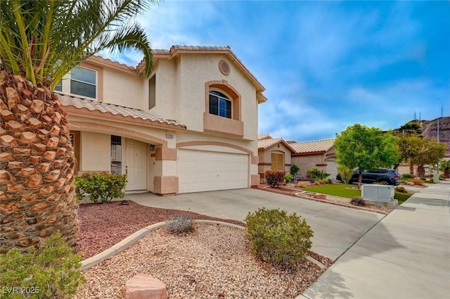 775 Wigan Pier Dr, Henderson, NV 89002 - mediterranean / spanish home with driveway, stucco siding, a garage, and a tiled roof