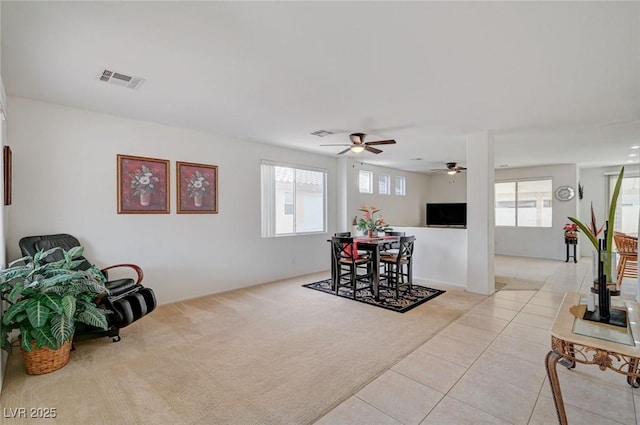 775 Wigan Pier Dr, Henderson, NV 89002 - dining space with light tile patterned flooring, a healthy amount of sunlight, light colored carpet, and visible vents