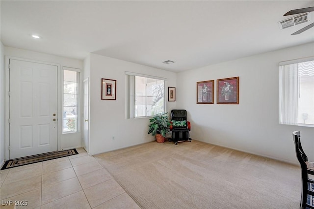 775 Wigan Pier Dr, Henderson, NV 89002 - foyer entrance featuring a ceiling fan, tile patterned floors, carpet, and visible vents