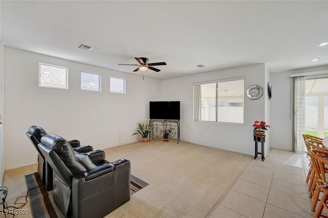 775 Wigan Pier Dr, Henderson, NV 89002 - living area featuring light colored carpet, visible vents, ceiling fan, and light tile patterned floors