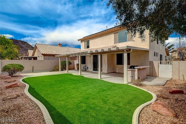 775 Wigan Pier Dr, Henderson, NV 89002 - back of property with a patio area, stucco siding, a fenced backyard, a pergola, and a yard