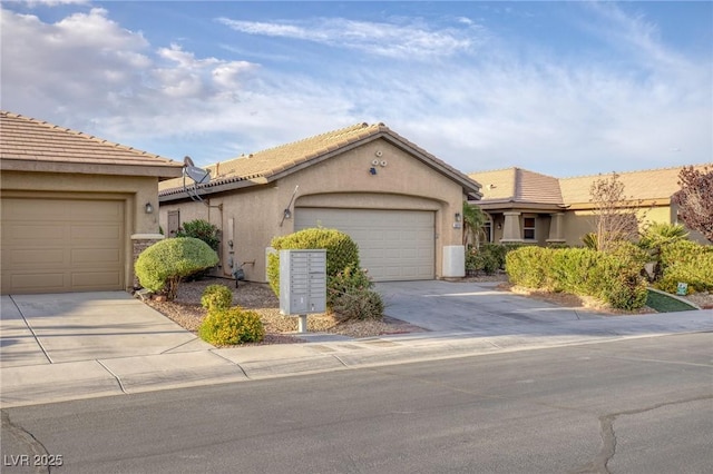 ranch-style home featuring an attached garage, stucco siding, and driveway