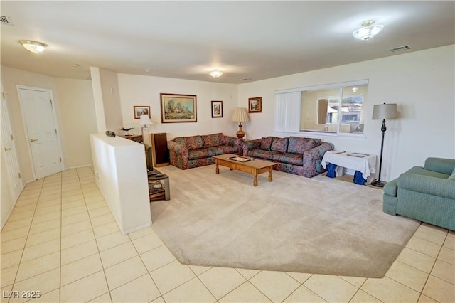 tiled living room featuring visible vents