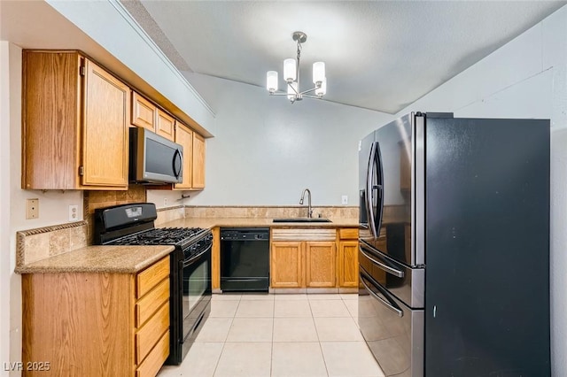kitchen featuring light countertops, a chandelier, a sink, light tile patterned floors, and black appliances